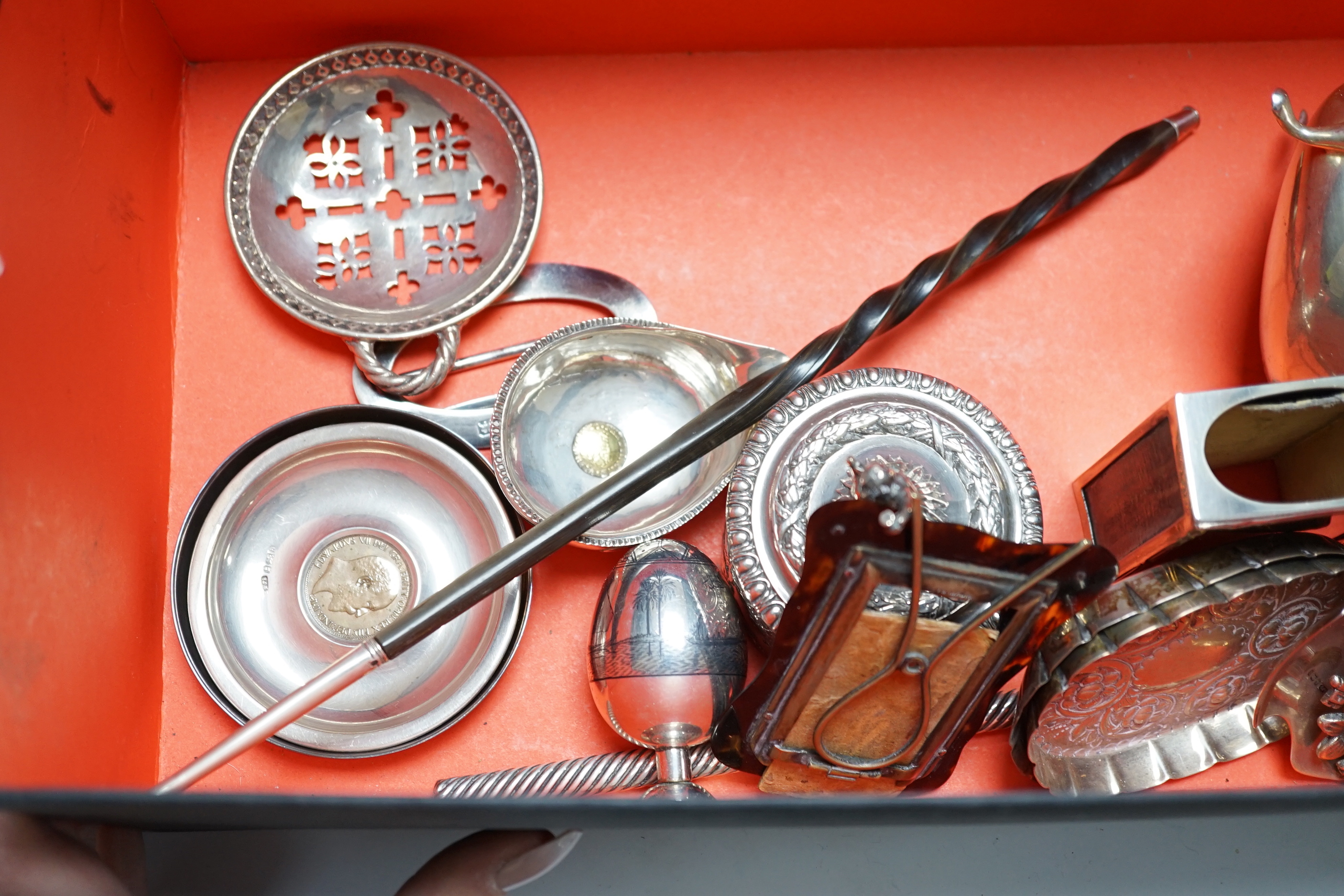 Assorted small silver including pair of silver sauceboats, a small jug and vase, a salts bottle, condiments, photograph frames, a matchbox sleeve, etc.